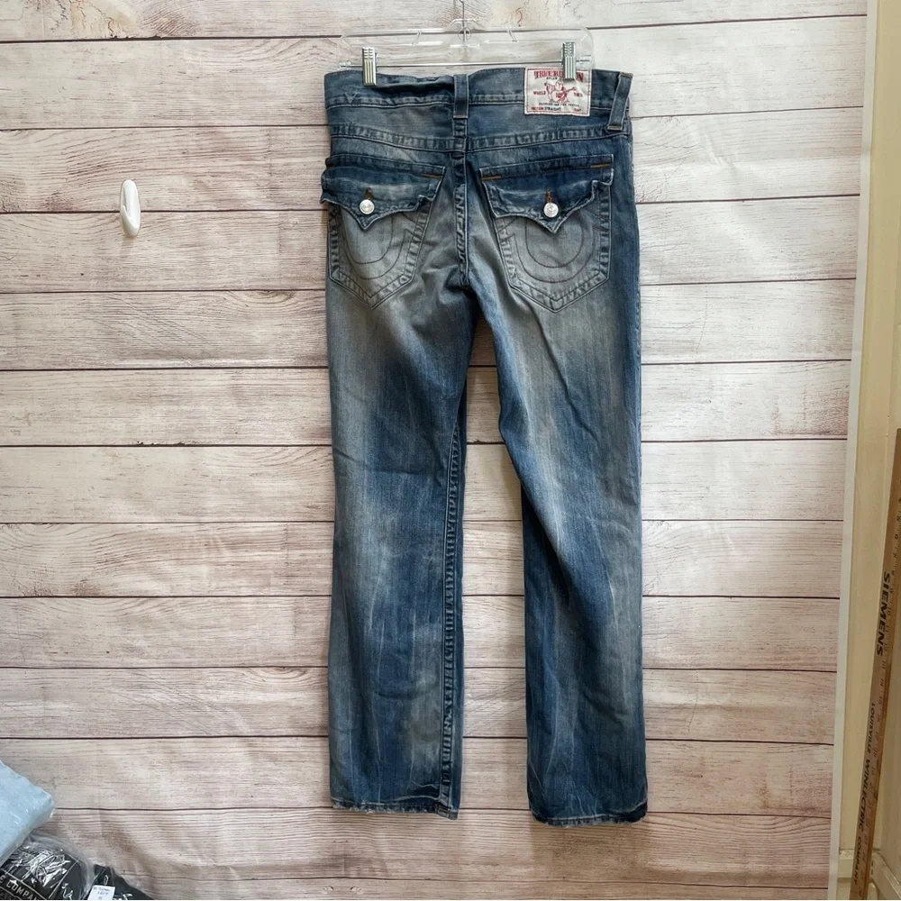 TRUE RELIGION STRAIGHT FLAP DISTRESSED JEANS‎